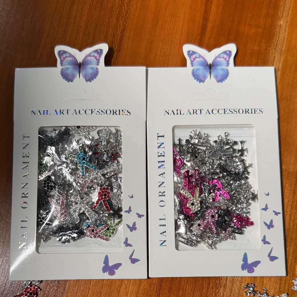 3-D rhinestone and metal nail ornaments, Playboy bunnies and crosses